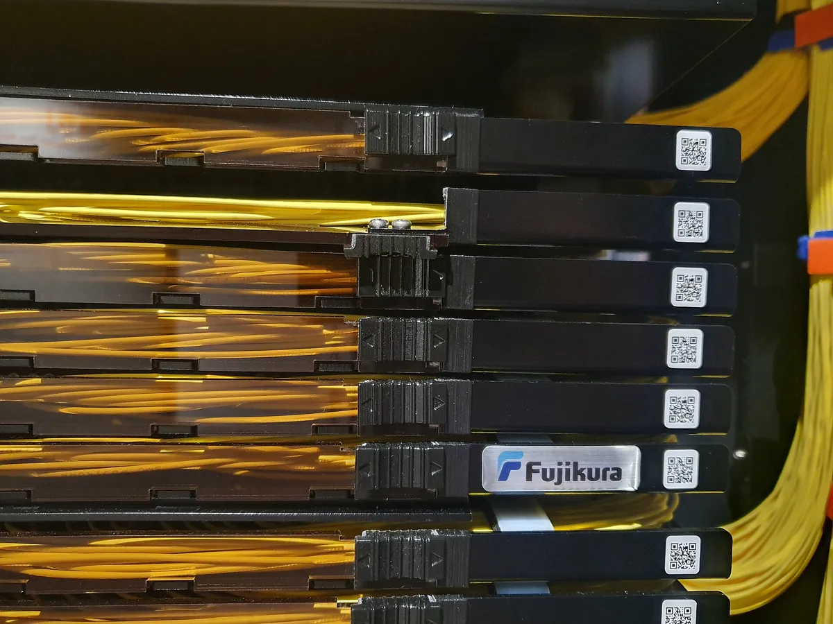 Bundle of optical fibre strands glowing at their tips